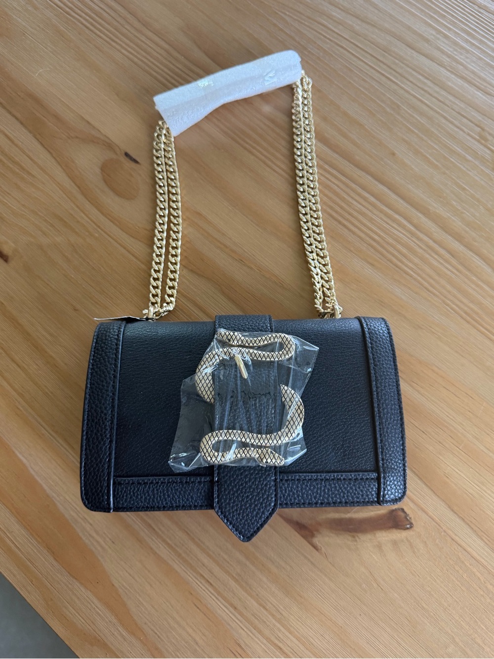 Black Leather Shoulder Bag with Gold Chain and Snake Accent
